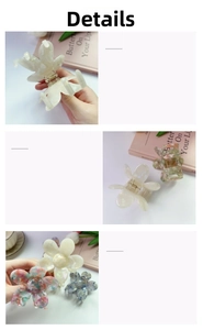 Detail view of flower hair claws in acetate finish with strong metal spring mechanism