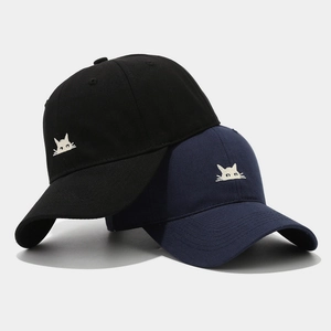 Black and navy cotton baseball caps with cute white cat embroidery in 45-degree view