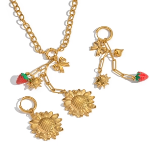 Golden sunflower and strawberry jewelry set with enamel pendants and bow details