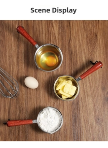 Stainless steel melting pot with wooden handle for butter and baking ingredients