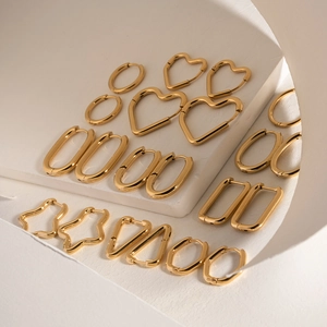 Minimalist gold geometric earring set featuring heart, star and circular stainless steel hoops
