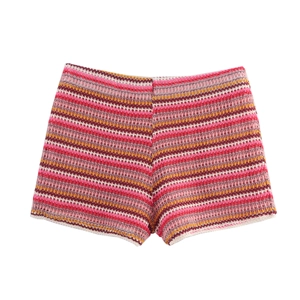 Detail of colorful striped crochet knit high waist shorts with wavy texture pattern