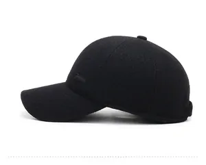 Side view of black wool baseball cap with SPORT metal plaque and six-panel stitch detail