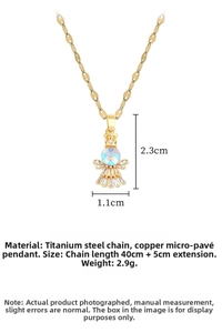 Detail view of gold angel pendant necklace with iridescent stone and micro-pave setting