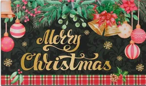 Macro shot of Christmas door mat detail featuring golden Merry Christmas lettering and pine leaves