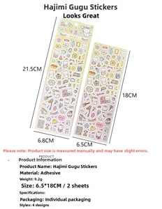 Detailed view of DIY cartoon sticker sheets with cute cat and bear motifs for scrapbooking
