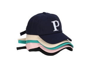 Multiple colors of cotton baseball caps featuring embroidered letter P in a neat stack