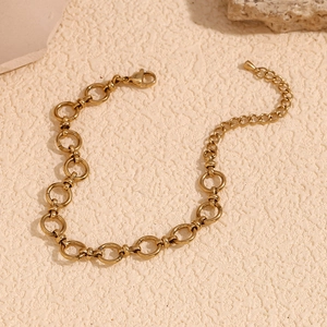 Detail of 14K gold plated stainless steel chain necklace with toggle clasp on stone