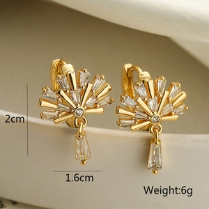 Detailed close-up of gold-plated fan-shaped earrings with clear sparkling zircon stones