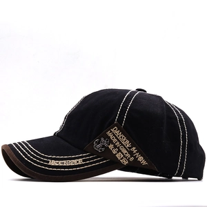 Detail view of cotton baseball cap with DANSKIN patch, thick stitching and metal anchor