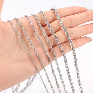 Various sizes of silver stainless steel rope chains shown on hand for comparison
