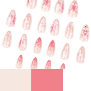 3D floral almond press-on nails with pink gradient, pearls, and crystals in a glossy finish