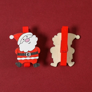 Detail view of mini wooden Santa Claus clips for Christmas party decor and DIY crafts