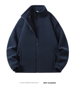 Macro view of navy blue fleece jacket showing thick faux fur lining and texture