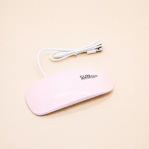 Macro detail of pink SUNmini UV LED nail lamp with folding stand and USB cable power