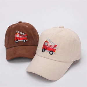 Detailed close-up of brown and beige baseball caps with fire truck embroidery
