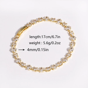 Macro detail of gold-tone zircon tennis bracelet showing 17cm length and 4mm width