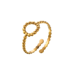 Detailed close-up of an 18k gold plated stainless steel ring with beaded texture design