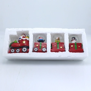 Christmas train snow globe set with Santa, reindeer and snowman in protective packaging
