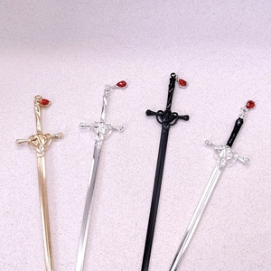 Chinese sword hairpins in gold silver and black with red teardrop charms and heart detail