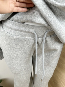 Detail of grey knitted drawstring waistband with high-quality sweatshirt cotton texture