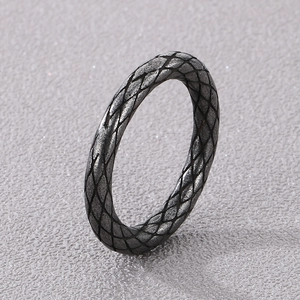 Macro shot of punk style stainless steel ring with detailed snake skin texture