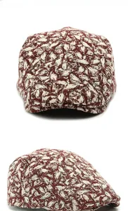 Multi-angle view of vintage jacquard flat cap with red and cream leaf pattern