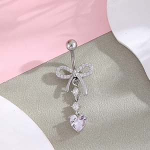 Silver bow belly ring with heart zircon pendant and shimmering crystal accents