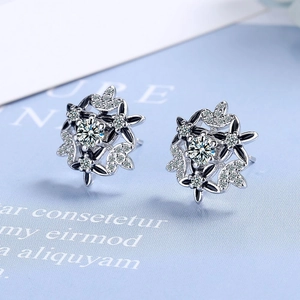 Elegant flower stud earrings with black enamel petals and sparkling cubic zirconia centers