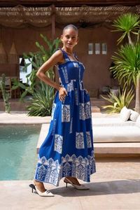 Detailed close-up of blue and white floral print maxi dress with elastic bust and frill straps