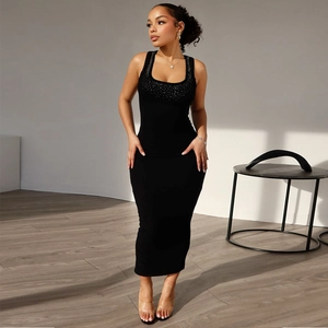 Detailed close-up of rhinestone embellishments on a black slim fit knit dress neckline