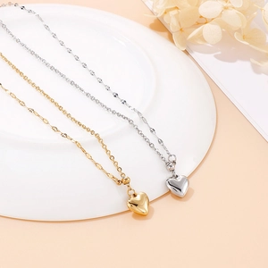 Minimalist heart pendant necklaces in gold and silver finish on beaded chains