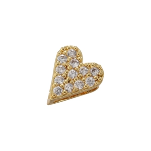 Macro detail of gold-plated heart pendant with micro-paved clear cubic zirconia stones