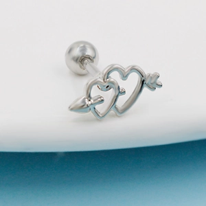 Close-up of heart and arrow cubic zirconia barbell stud earring in polished steel