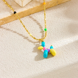 Cute golden bead necklace featuring a colorful balloon dog pendant in a vibrant design
