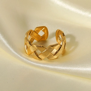 Elegant gold braided twist open ring made of durable stainless steel on silk background