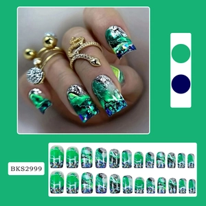 Detailed view of green marble press-on nails with silver foil and aurora glitter effect