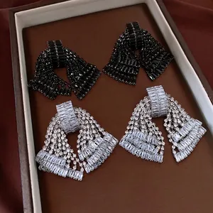Luxury bow tassel earrings with micro-paved zircons in black and silver finishes
