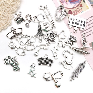 Detailed silver medical charms including stethoscope and syringe for DIY jewelry
