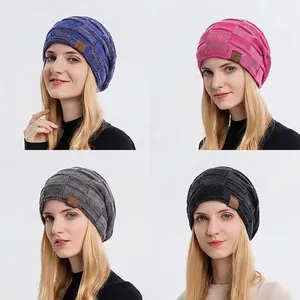 Winter fleece-lined knit beanie for women with checkered texture and leather peak patch