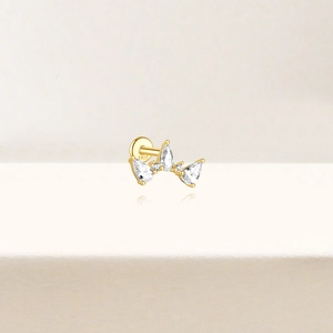 Detail of S925 sterling silver gold earring with pear-shaped cubic zirconia and S925 stamp