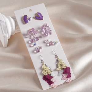 6-piece purple jewelry set with heart studs, floral drops, and butterfly tassel earrings