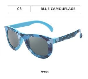 Close-up of blue camouflage pattern kids plastic party sunglasses at 45-degree angle