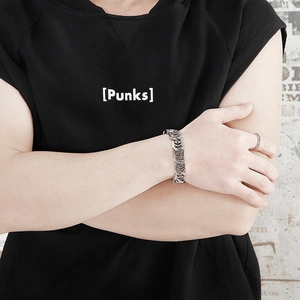 Detail of silver punk style chunky chain bracelet for men worn by a model