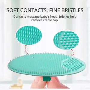 Oval mint green silicone baby bath brush with soft bristles for scalp massage