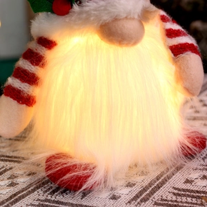 Lighted Christmas Rudolf gnome plush with red striped knit hat and glowing warm LED beard