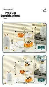 Detail of tiered glass fruit plates with gold metal handles and dimension markers