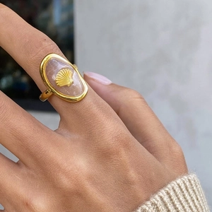 Gold-plated stainless steel open ring with pink oval inlay and shell detail on model