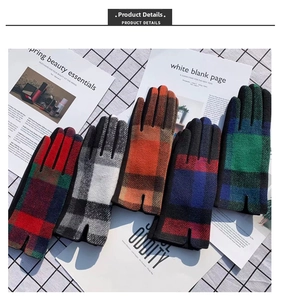 Flat lay of five checkered winter gloves in various classic plaid patterns and thick knit material
