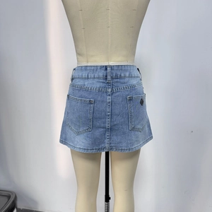 Detail view of high-waist denim skirt back with five-pocket design and soft wash texture